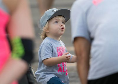 A little boy looks up to an older man