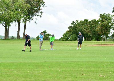 Four men playing golf