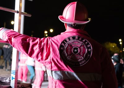 a man wearing a pink firefighter uniform