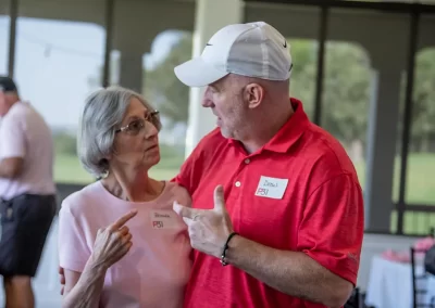 And older woman talks with a middle-aged man