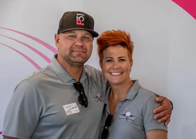 Couple wearing matching grey polo shirts