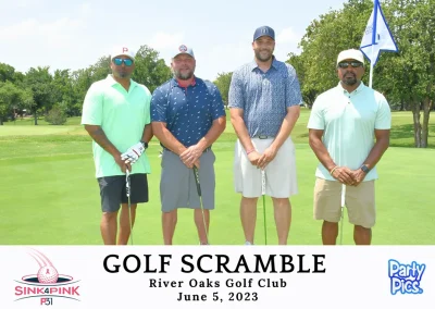 Four men on a golf course, each with a golf club. Wearing mint green, blue with read, blue patterned, and light green shirts (Left to right)