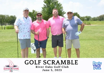 male players wearing pink and grey polos on golf course