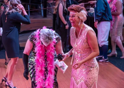 Two woman laughing and dancing