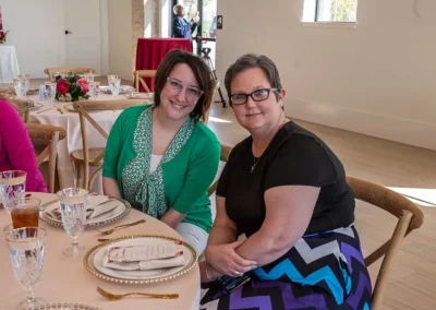 Two women enjoying time together at the 2023 Proton Luncheon
