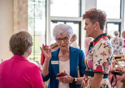 Three women engaged in conversation