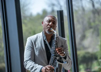 A man plays the saxophone