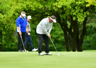 A man putting his golf ball